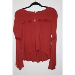Red long-sleeve women’s top